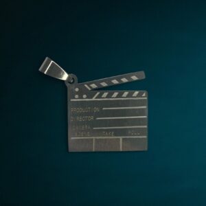 Dije Claqueta Cine/Director + Cadena - Acero Quirurgico